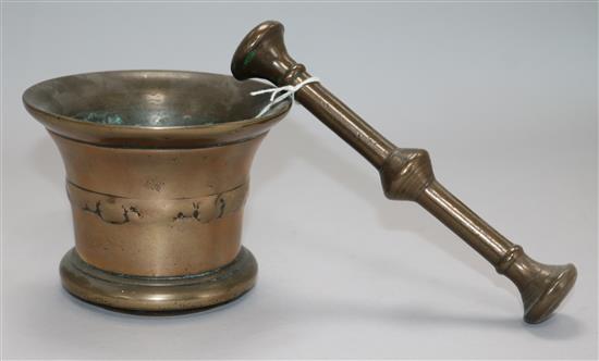 An 18th century bronze pestle and mortar